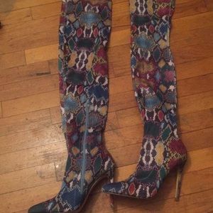 Women’s very stylish multicolored snakeskin boots.